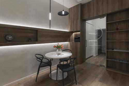 a kitchen with a table and chairs in a room at Dimora Don Minzoni in Matera