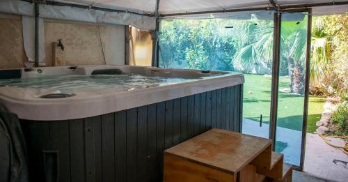 a large bath tub in a tent at Villa Balluta in St Julian's