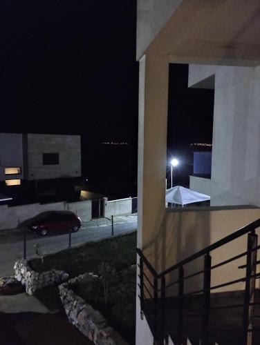 a night view of a building with a parking lot at Villa Twins Dojran in Nov Dojran