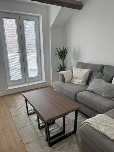 a living room with a couch and a coffee table at Bay View House in Bangor