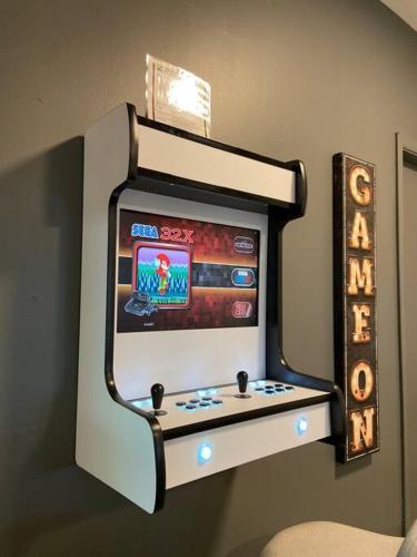 a video game system on the wall of a room at Poconos Oasis with Game Room in Pocono Summit