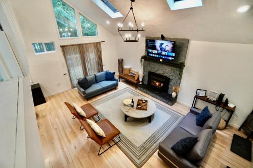 an overhead view of a living room with a fireplace at Poconos Oasis with Game Room in Pocono Summit