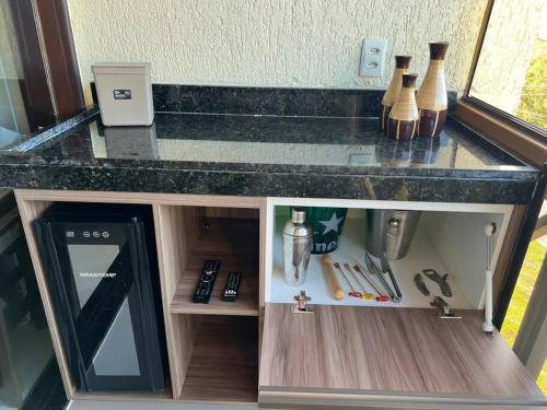 Küche/Küchenzeile in der Unterkunft Flat Fazenda Monte Castelo Gravatá