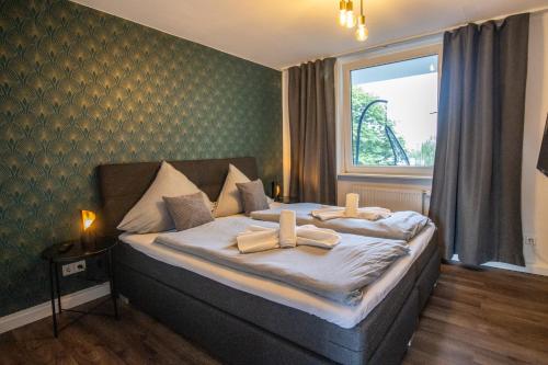 Postel nebo postele na pokoji v ubytování Messewohnung für 5 Gäste mit Balkon und Lift