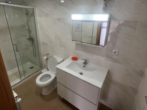 a bathroom with a toilet and a sink and a shower at 1 bed House - Sleeps 4 - Balcony - Mtn View in Coja