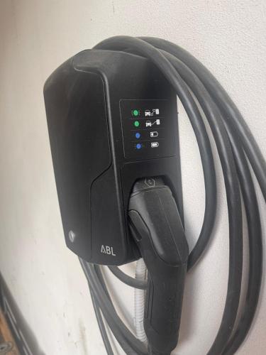 a car charger with a usb cord plugged into a wall at casa carmelo in Schio
