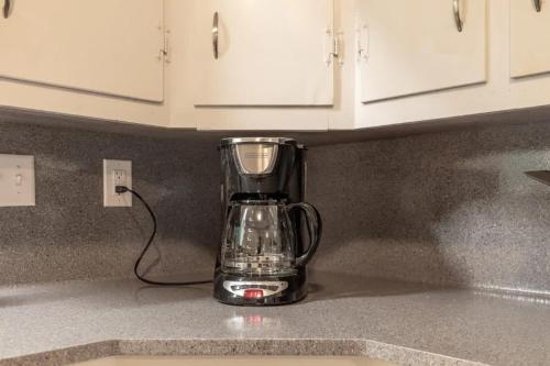 a blender sitting on a counter in a kitchen at Spacious 4BR Home with 2 Baths & Fun Game Room in Birmingham