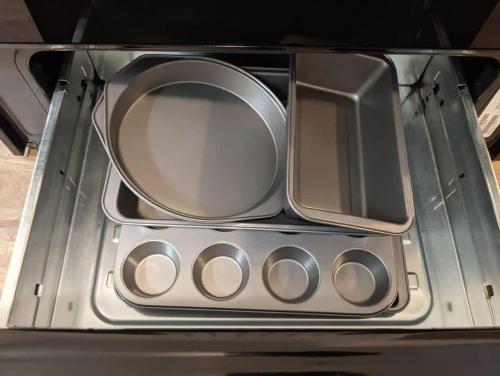 a metal stove top with a bunch of silver knobs at Spacious 4BR Home with 2 Baths & Fun Game Room in Birmingham
