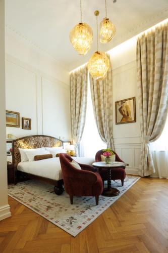 Voodi või voodid majutusasutuse Hotel Fleur de Ville toas