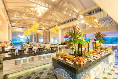 a buffet in a hotel with food on display at Marriott's Phuket Beach Club in Mai Khao Beach