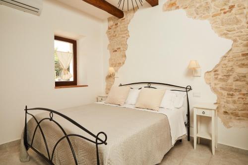 En eller flere senge i et værelse på Alba di Luna