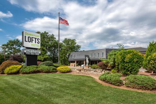 a sign for a southern lights hotel with an american flag at Amwell Suites in Ukrainian Village