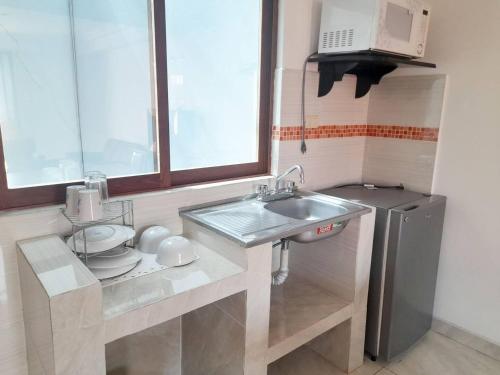 Η κουζίνα ή μικρή κουζίνα στο Hotel Posada Del Parque