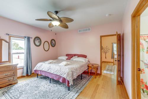 a bedroom with a bed and a ceiling fan at Near Saugatuck Dunes Pet-Friendly Fennville Home! in Fennville