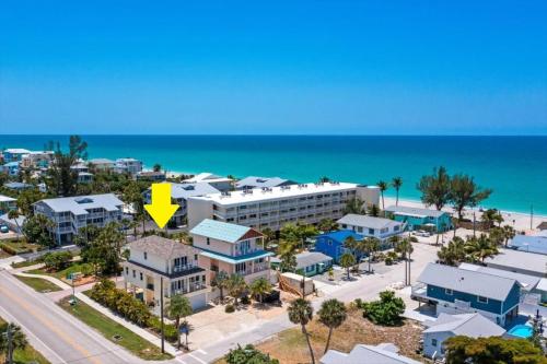 an aerial view of a resort with a yellow arrow at Sand Dollar Siesta-walk to beach less than 1 min! in Englewood