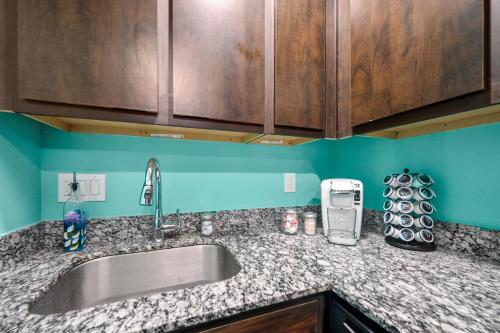 a kitchen counter top with a sink and aounter at Central 1BR with Free Parking Near Med Center & NRG Stadium in Houston