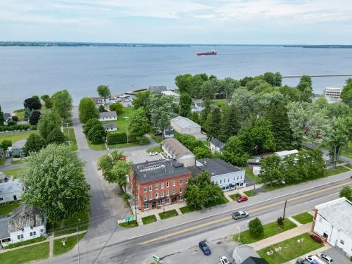 an aerial view of a small town by the water at The Roxy Cape Vincent in Cape Vincent