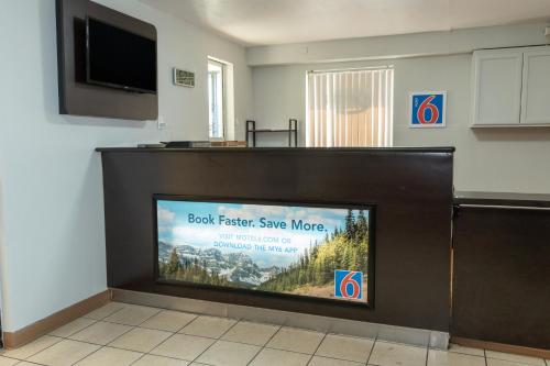 a large flat screen tv in a room at Motel 6-Cincinnati, OH in Cincinnati