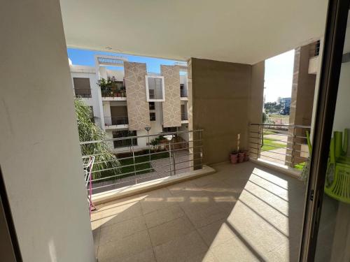 an open balcony with a view of a building at Prestigia luxury home in Fès