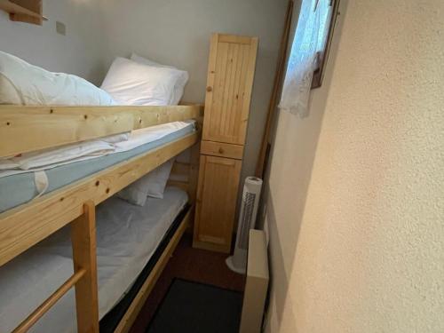 a small room with two bunk beds in it at Studio calme avec balcon sud, parking, 4 pers max – Abondance - FR-1-692-100 in Abondance