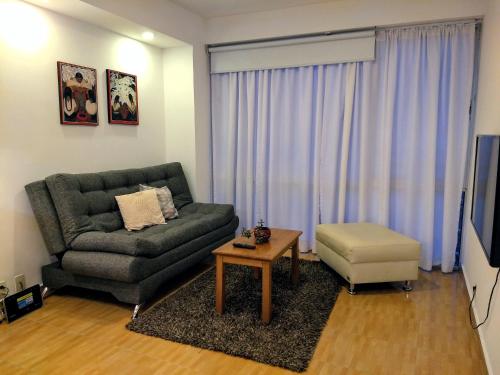 a living room with a couch and a table at El Mirador Centro Histórico in Mexico City