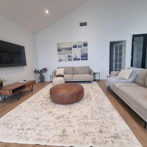 a living room with two couches and a coffee table at Casena in McCracken