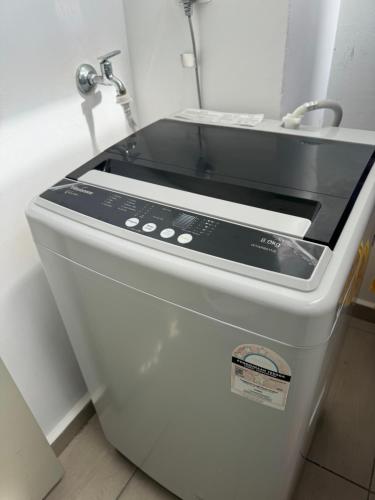 a stove top oven sitting in a kitchen at 2BR Apartment - Beachfront - Corner Unit - Netflix - Unifi 300mbps - Mutiara Melaka Pantai Puteri in Malacca
