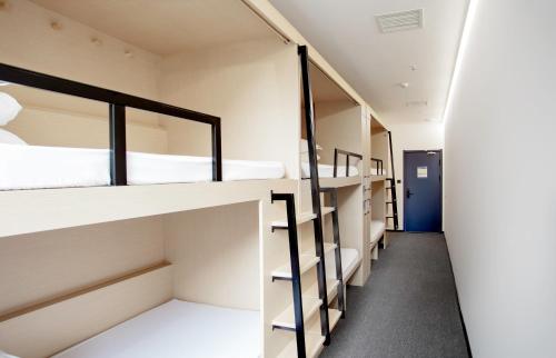 Palanda nebo palandy na pokoji v ubytování Sifang Space Hostel Xi'an - Xi'an KEJIDAXUE metro Line4