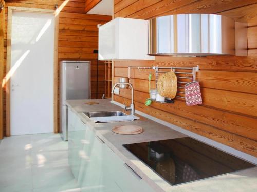 a kitchen with a sink and a counter top at Holiday Home Magazzini with Sea View in Magazzini