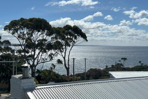 a view of the ocean from the roof of a house at TOP DECK - Panoramic water views of the Bay of Fires in Binalong Bay