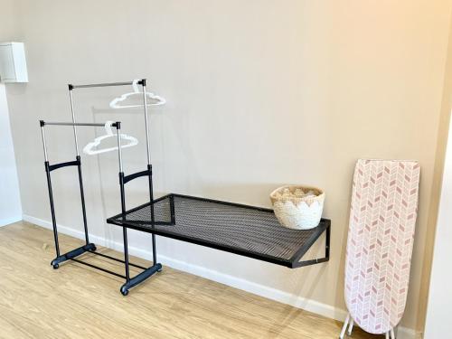 a black shelf in a room with a wall at Deco Home @ Aru Suites in Kota Kinabalu
