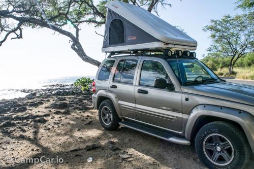 a truck with a camper on the top of it at CampCar Maui Jeeps SUVs Hybrid Camper van Rentals with equipment and Travel Advice in Kahului
