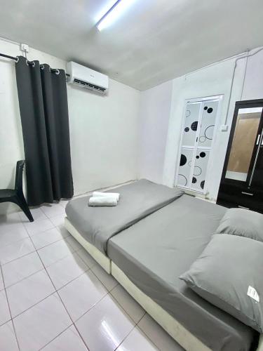 a bedroom with a bed in a room at Casaria Beach in Paka