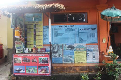 a sign on the side of a building at Donald Home Stay in Ubud