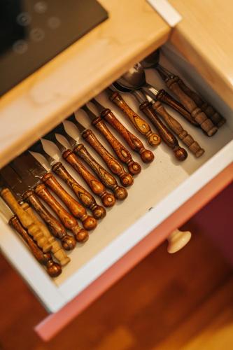 a row of cooking utensils in a drawer at Rezi Pava in Pava