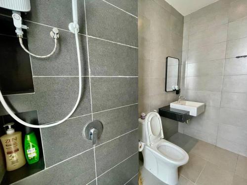 a bathroom with a toilet and a shower at Industrial Style 2 Bedroom Unit Urban Suites Georgetown Sea View Jelutong in Jelutong