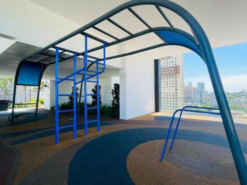 a blue metal structure in a room with a view at Industrial Style 2 Bedroom Unit Urban Suites Georgetown Sea View Jelutong in Jelutong