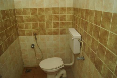 a bathroom with a toilet and a shower at Prems Homestay in Cochin