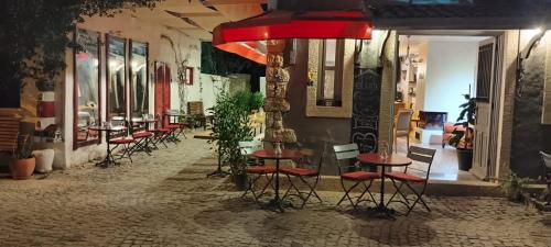 a row of stools in front of a restaurant at al'çatı flaneur in Cesme