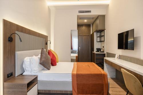 Una televisión o centro de entretenimiento en Nuca Homes