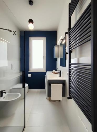 a bathroom with a sink and a toilet and a tub at Residence Panorama Palinuro in Palinuro
