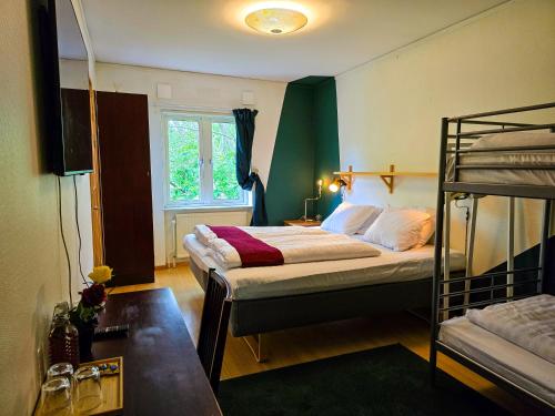 Postel nebo postele na pokoji v ubytování Nature Shelter Hotel
