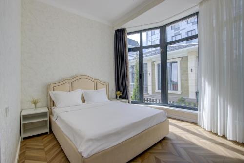 Ένα ή περισσότερα κρεβάτια σε δωμάτιο στο NOVEL hotel and Apartments