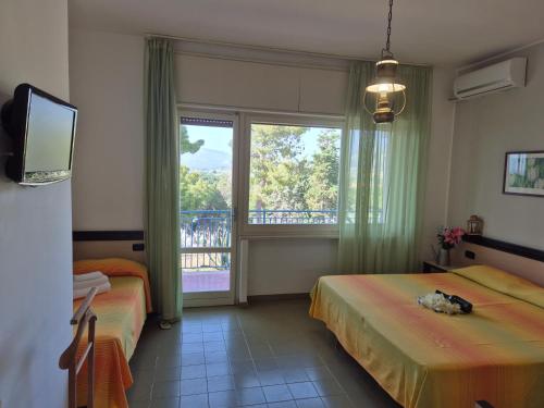 Postel nebo postele na pokoji v ubytování Hotel Guardacosta