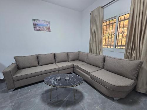 a living room with a couch and a table at Chouf View Residence in Baddah