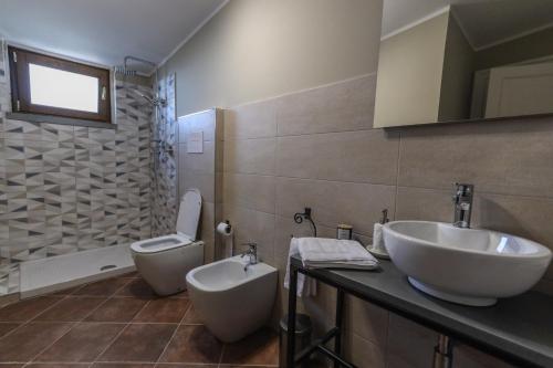 a bathroom with a sink and a toilet at RUGGIERO GUEST HOUSE in Cicerale