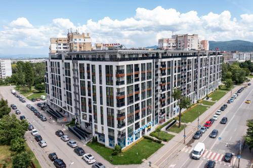 an overhead view of a large white building on a city street at Sonata Apartment Sofia in Sofia