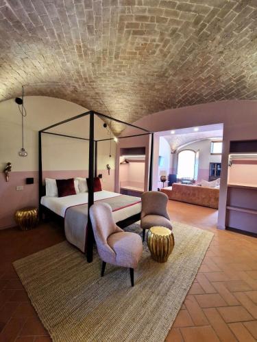 Ένα ή περισσότερα κρεβάτια σε δωμάτιο στο Borgo Dolciano
