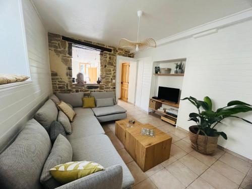 Ein Sitzbereich in der Unterkunft La Maison Cosy