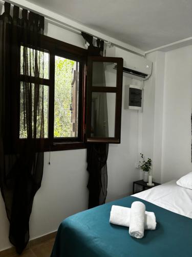 Katil atau katil-katil dalam bilik di Stella's Olive Tree House